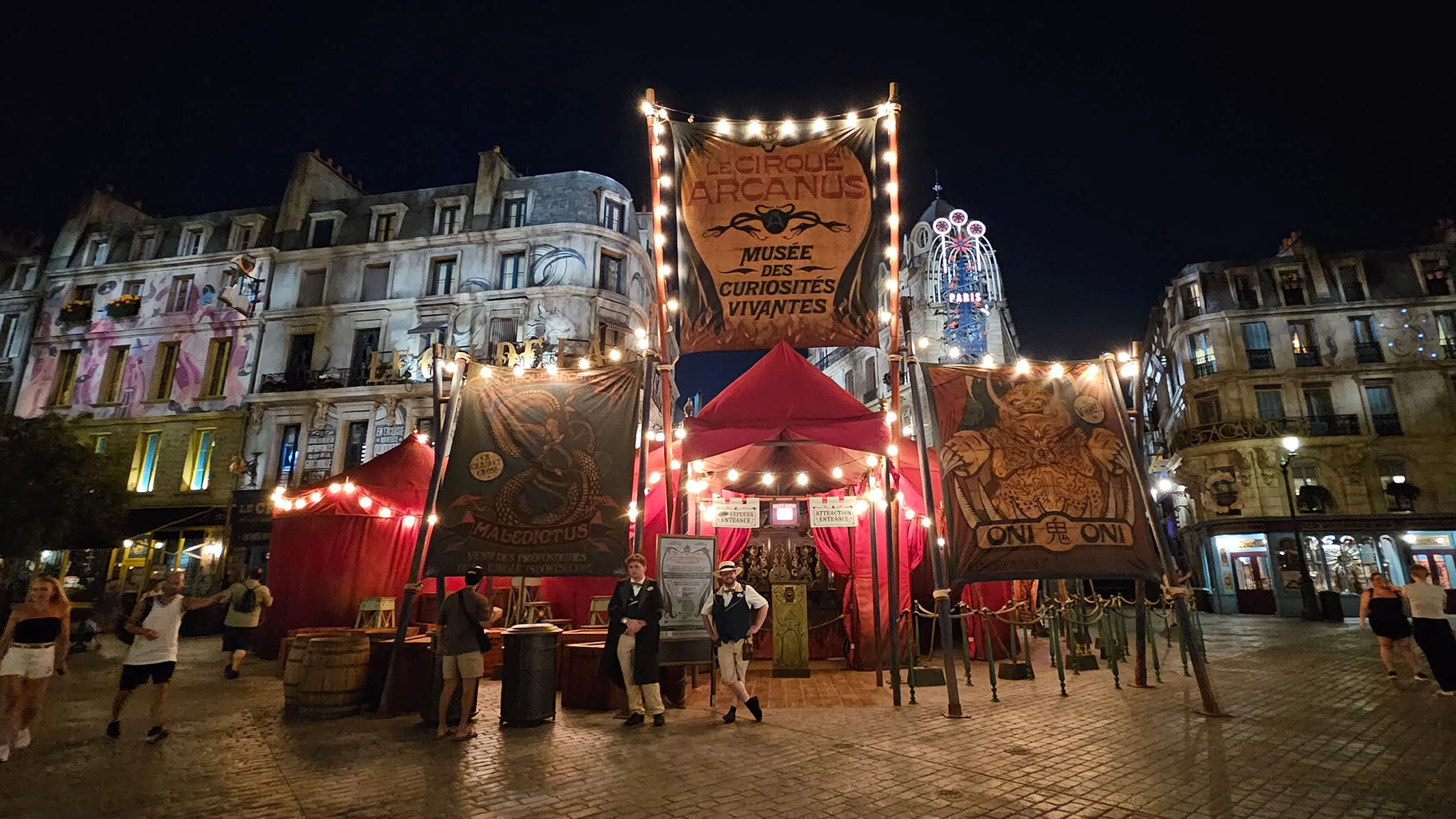 Le Cirque Arcanus on the Paris street of the Ministry of Magic land at night